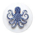 Elevate your dining experience with our round vinyl placemat featuring a captivating octopus design, inspired by Portuguese ceramic artistry. These placemats boast bold colors. Bring a touch of maritime charm to your table setting.